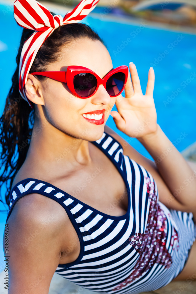 Beautiful pin up girl near the swimming pool Beautiful pin up girl near the swimming pool