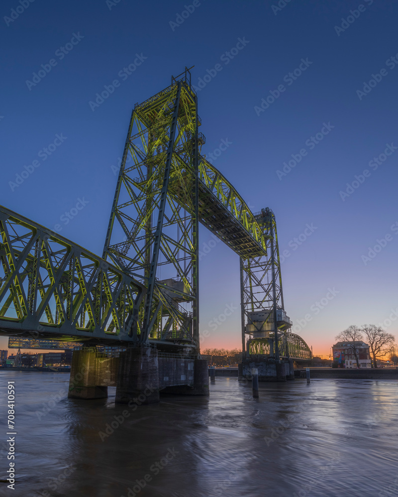blue hour view of the Koningshavenbrug, De Hef railway bridge in Rotterdam, The Netherlands, sunrise