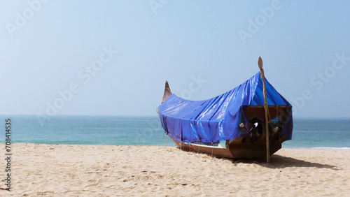 Fishing boat moored on the beach at Adimalathura, Thiruvananthapuram, Kerala, India