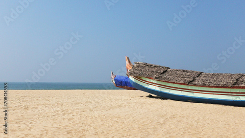 Fishing boat moored on the beach at Adimalathura, Thiruvananthapuram, Kerala, India photo