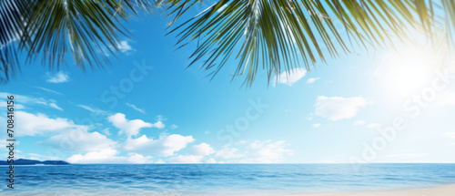 Paradise beach with palm trees and blue sky