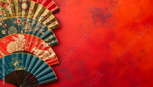 Traditional Chinese Hand Fans on Red Festive Background