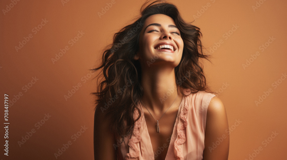 Portrait of a beautiful young woman with long curly hair laughing . Portrait of a beautiful young woman with long curly hair laughing .