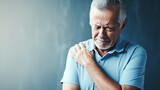 Senior elderly man touching his shoulder, shoulder health problems. Healthcare, insurance