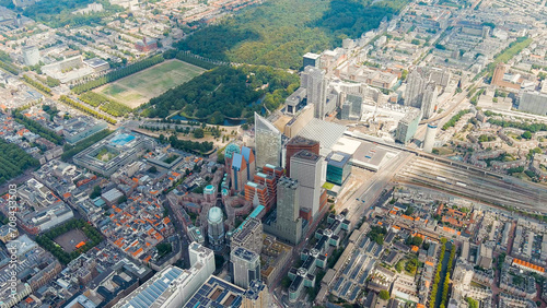 The Hague, Netherlands. Business center of The Hague. Large train station Den Haag Centraal. Cloudy weather. Summer day, Aerial View © nikitamaykov