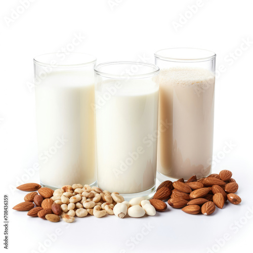 Three Glasses of Milk and Almonds on White Background