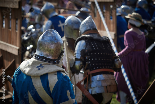 Battle of medieval knights. Medieval warriors in armor. Reenactors of historical events.