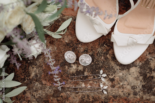 Obraz na płótnie Bride's accessories with shoes, earings and lavander bouquet w salonie