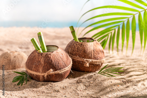 Fresh coconut milk in shell on an resort island. photo
