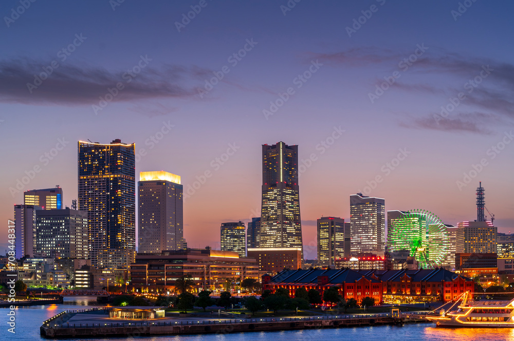 Naklejka premium sweet blue and pupper sunset winter and light illumination from Cityscape of Yokohama city, Skyline and office building and downtown in Minatomirai Area, Yokohama city port, Kanagawa, Japan