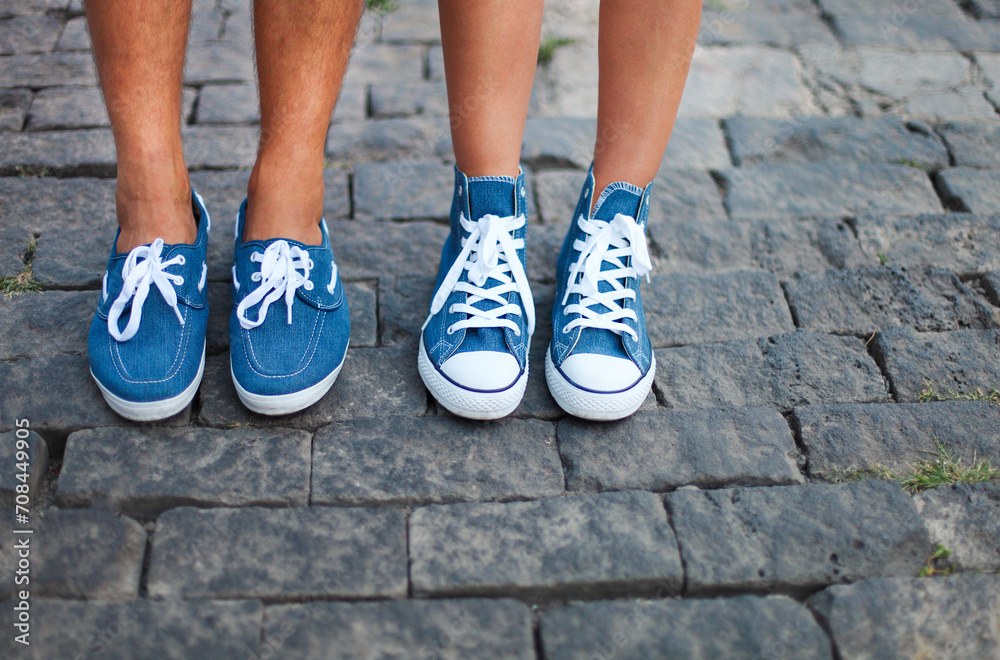 Boyfriend and girlfriend feet wearing sneakers
