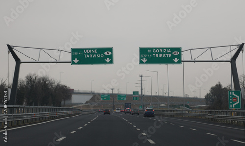 motorway video in northern Italy with indications for the border of Austria or Slovenia and more cities