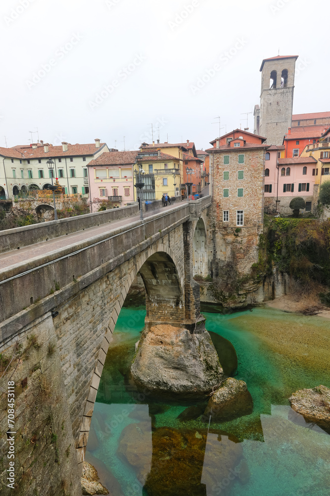 Natisone river in the city of Cividale del Friuli in Italy and long ancient bridge called Bridge of the Devils Bridge