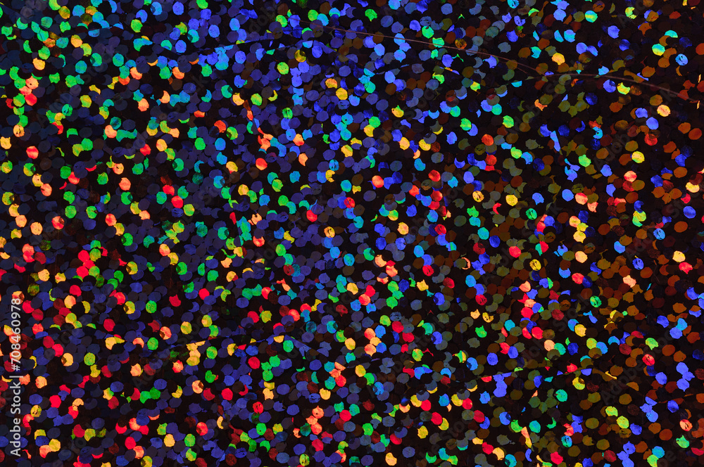 detail photo of cool dark rainbow holographic dot foil material, colorful hologram surface, glitter pixel pattern background.