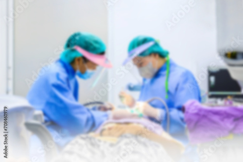 Interior of dental clinic with blurred background doctor Doctor is extracting tooth and professional dental tools Dental surgery in a hospital or clinic.