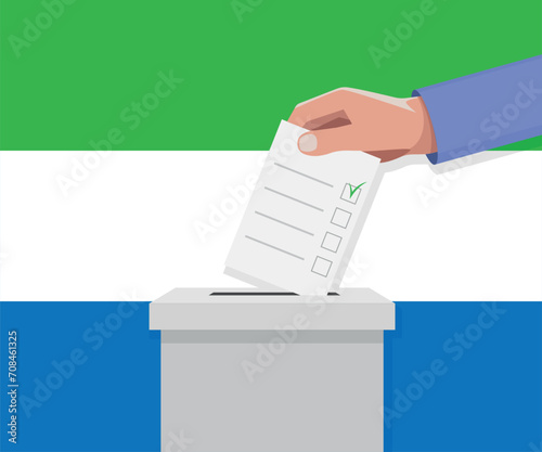 Sierra Leone election concept. Hand puts vote bulletin