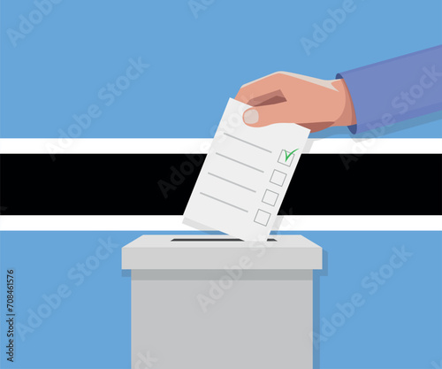 Botswana election concept. Hand puts vote bulletin