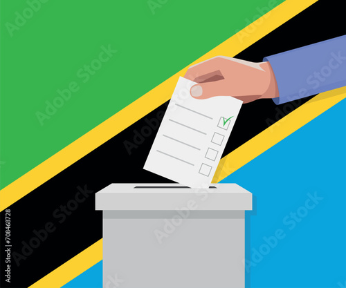 Tanzania election concept. Hand puts vote bulletin into vote box.