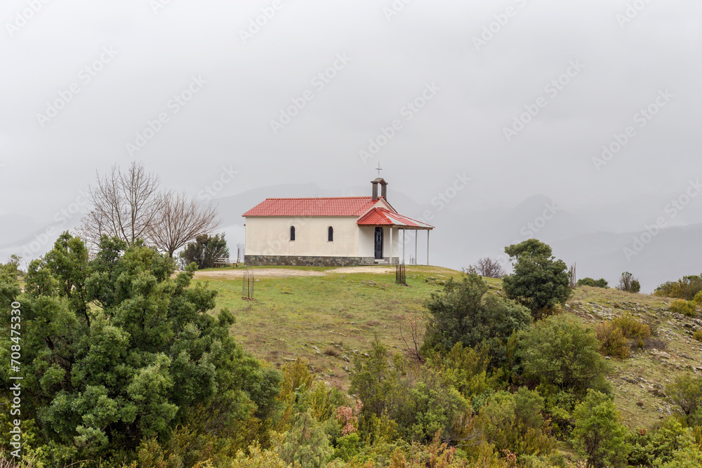 Small, Christian church in the mountains on a winter day Small, Christian church in the mountains on a winter day