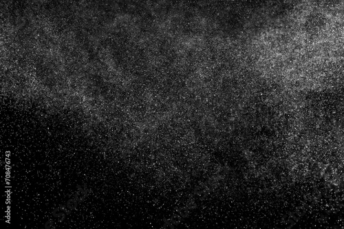 Texture dark pattern. Abstract splashes of water on black background. Freeze motion of white particles. Rain, snow overlay. 