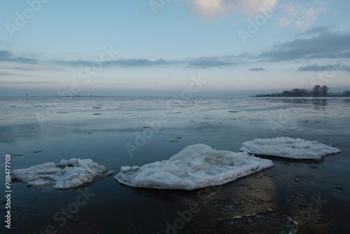 Shuga - ice floe in shape of discs. An interesting phenomenon on Vistula river. The estuary of  Vistula, Sobieszewska Island, Poland photo