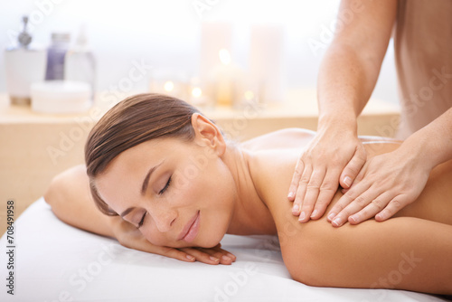 Woman, hands and back massage at spa, aromatherapy and healing with wellness. Calm, peace and beauty with skincare, body care and health, masseuse with holistic treatment for zen or stress relief photo