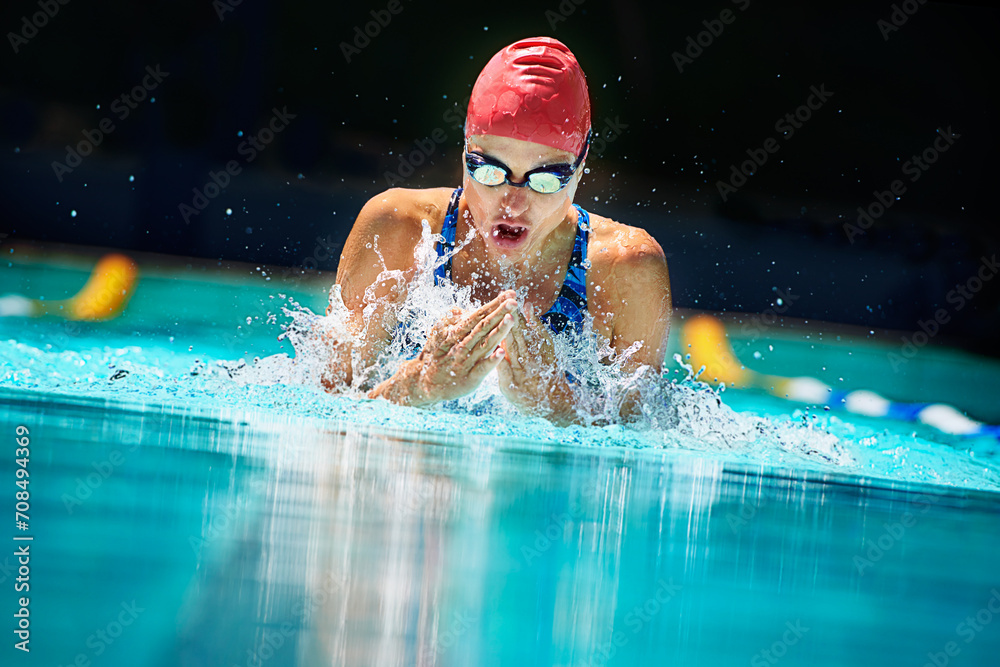 Sports water splash or woman in swimming pool for competition training workout or energy. Fitness breathing or cardio with female swimmer and athlete for exercise championship and race at gala Stock