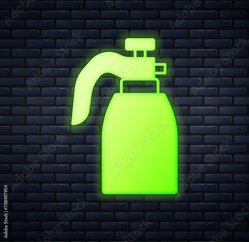 Glowing neon Garden sprayer for water, fertilizer, chemicals icon isolated on brick wall background. Vector