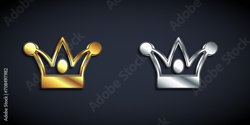 Gold and silver Jester hat with bells isolated on black background. Clown icon. Amusement park funnyman sign. Long shadow style. Vector photo