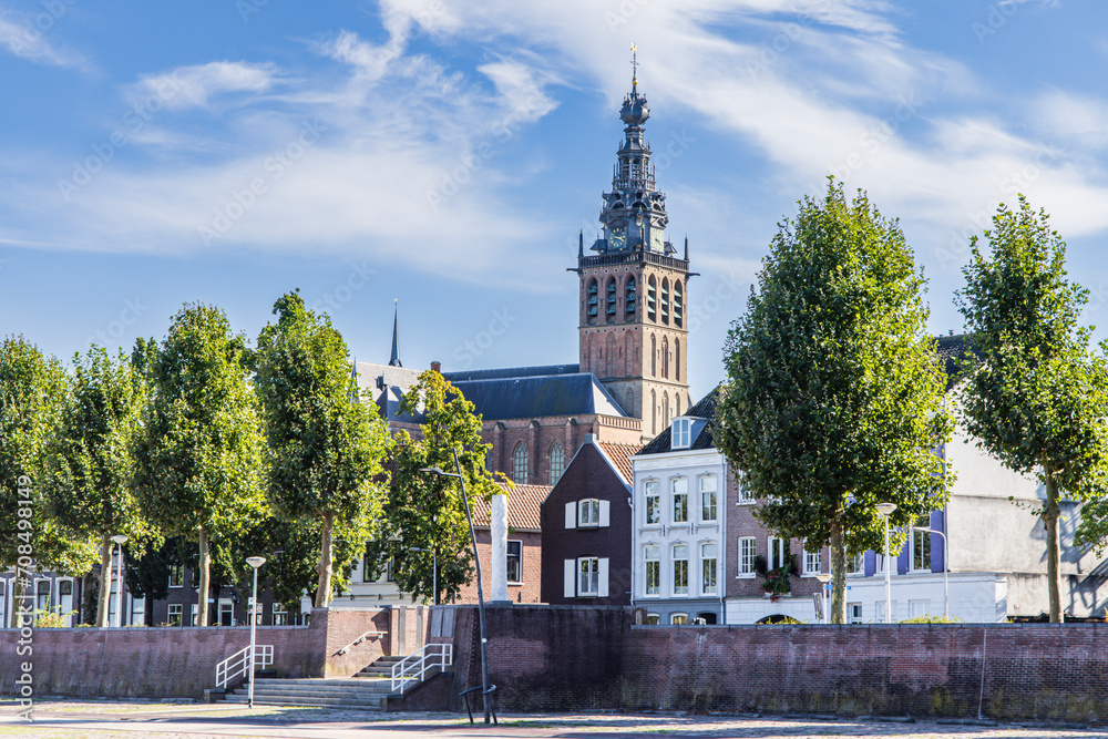 Cityscape of Nijmegen in The Netherlands with church from river quay called Waalkade along river Waal on a sunny autumn day Cityscape of Nijmegen in The Netherlands with church from river quay called Waalkade along river Waal on a sunny autumn day