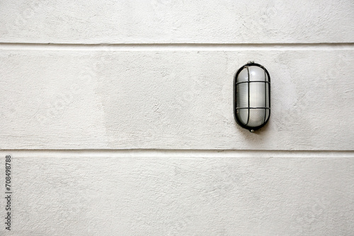 фотографія Small industrial decoration style lamp on rough exposed brick wall