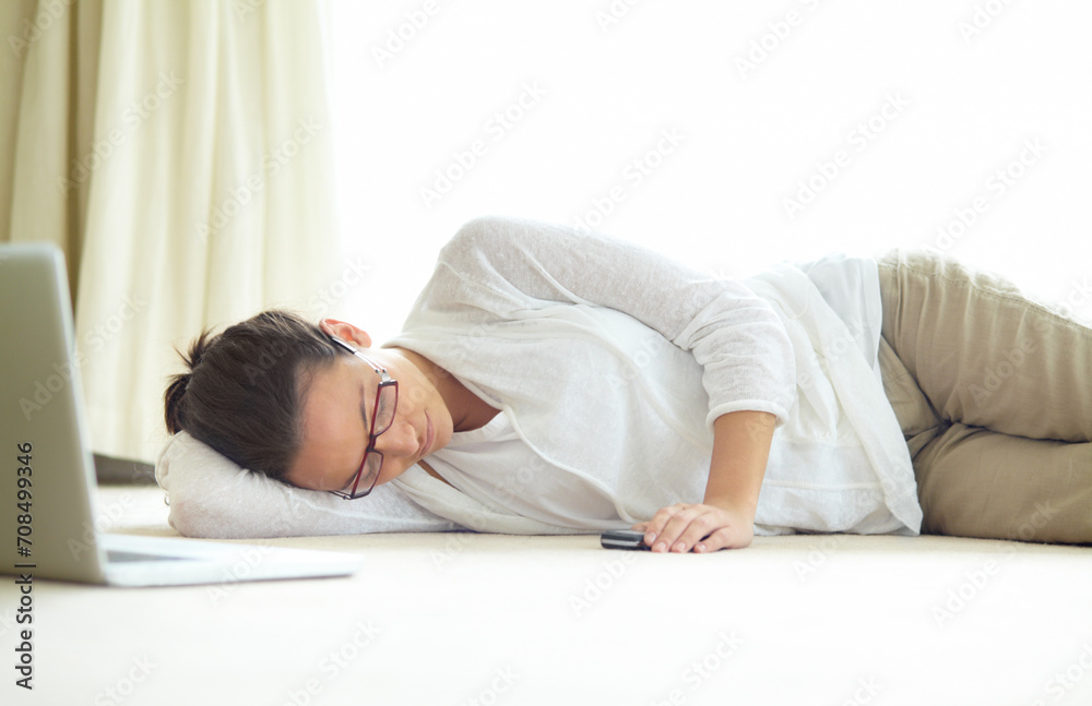 Remote work, burnout and tired woman sleeping on a floor with low energy, exhausted or nap after laptop project. Freelance, fatigue or female person in living room for, dreaming or break in house Remote work, burnout and tired woman sleeping on a floor with low energy, exhausted or nap after laptop project. Freelance, fatigue or female person in living room for, dreaming or break in house