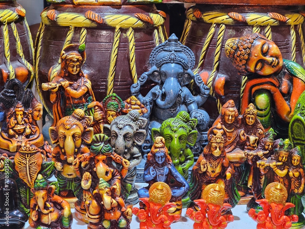 Naklejka premium An Indian god embodies divine power, wisdom, and compassion. Adorned with vibrant attire and sacred symbols, they inspire devotion and reverence. Their stories, depicted in ancient scriptures, teach m