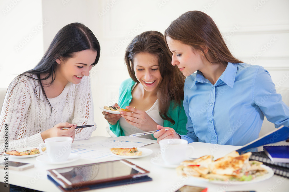 Group of students studying together at home