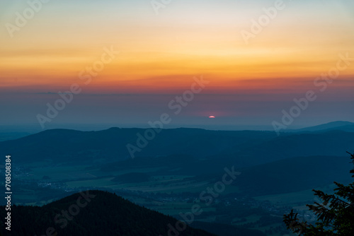 Sunrise from Cervena hora hill in Jeseniky mountains in Czech clouds photo