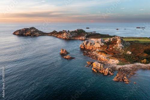 .Drone view of Primel Tregastel, ocean coast in France, Brittany at sunset. photo
