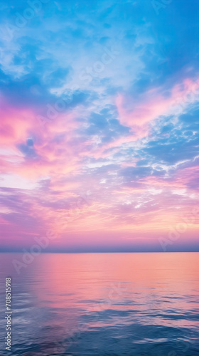 Pastel or pink sky at sunset, soft clouds, reslection in the sea water, phone wallpaper, aesthetic background for Instagram stories and reels  © AnnTokma