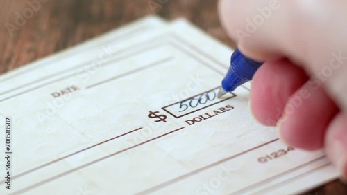 Wallpaper Mural Hand sign a bank check on wooden table background, Blank bank cheque, Prepare writing a check, closeup, Torontodigital.ca