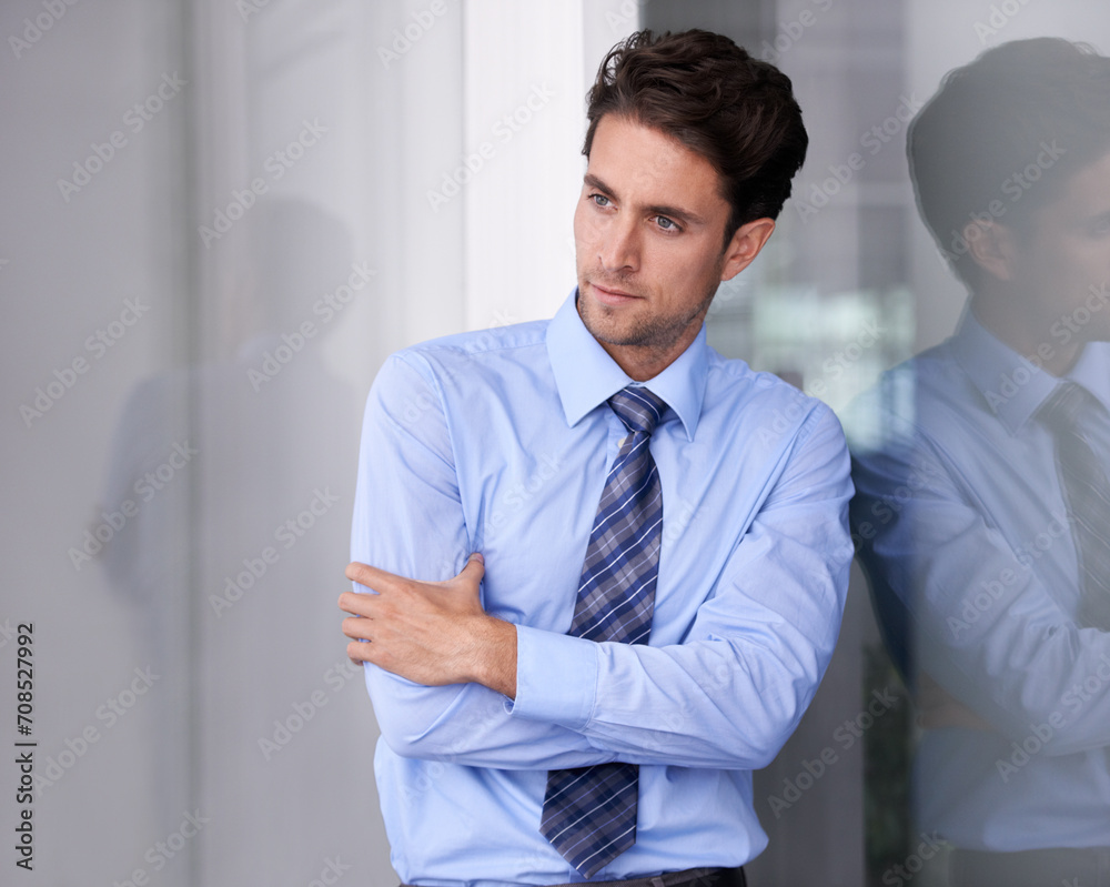 Window, crossed arms and serious business man in workplace with confidence, pride and ambition. Corporate entrepreneur, professional and worker thinking for career, job and working in modern office