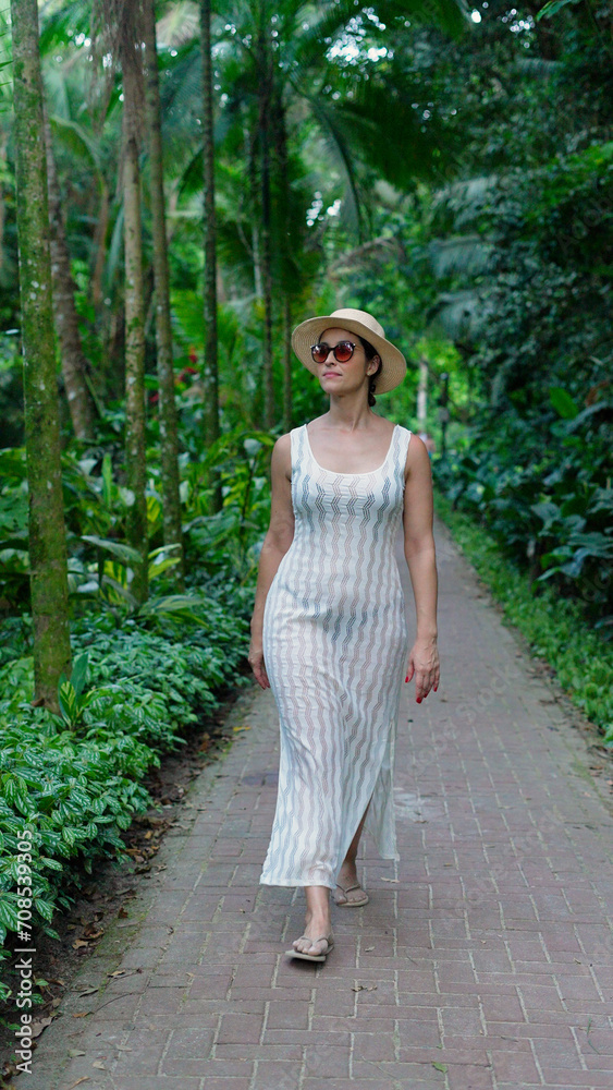 Happy traveler blogger adores summer vacation. Slow motion elegant lady happily walking by tropical island on sunny summer day. Woman enjoying palm trees and ocean landscape. Vertical
Happy traveler blogger adores summer vacation. Slow motion elegant lady happily walking by tropical island on sunny summer day. Woman enjoying palm trees and ocean landscape. Vertical