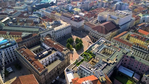 Aerial view of the Old Square with a monument to the artist and inventor Leonardo da Vinci next to the La Scala opera house theatre. Vittorio Emmanuele gallery in Milan Italy 2024 photo