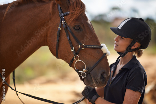 Woman, care and horse in nature with vacation, bonding and relax on farm, ranch and countryside. Animal, pet and person feeling stallion for freedom, adventure and training with peace and calming © Tasneem H/peopleimages.com