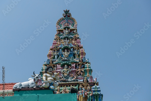 Hindu god statue by roof at Sri Mariamman Temple, Singapore photo
