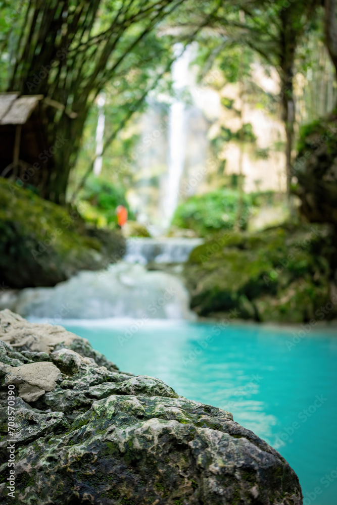 Fototapeta premium Serene Tropical Waterfall Oasis - Tranquil Nature Escape