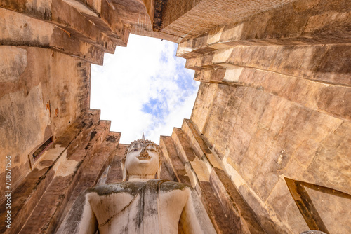 Close up of Buddha statue inside Sri Chum temple in Sukhothai Historic Park, a destination of tourist in Thailand