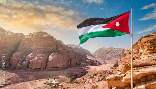 Jordan flag waving on the wind against Petra and Jordan city photo