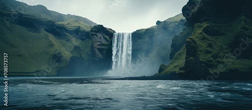 Fototapeta Naklejka Na Ścianę i Meble -  Scenic waterfall in front of a beautiful landscape, created with AI