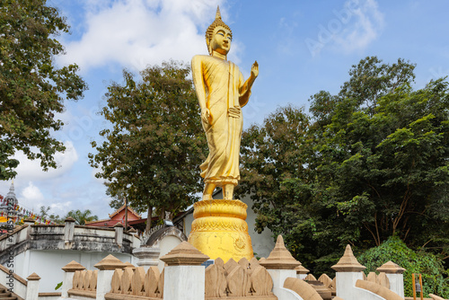 The iconic standing Buddha in Wat Phra That Khao Noi, one of the most tourist attraction destination places in Nan province, Northern of Thailand