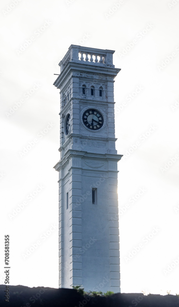 old clock tower in Dutch fort, Matara Sri Lanka, clock tower in white sky background 