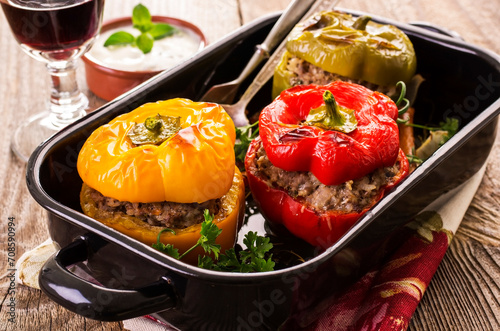 Traditional German stuffed bell peppers with minced meat served as close-up on a classic design backing pan photo